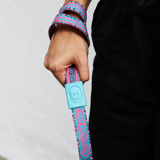 woman's hand holding the Candy NitLeash 