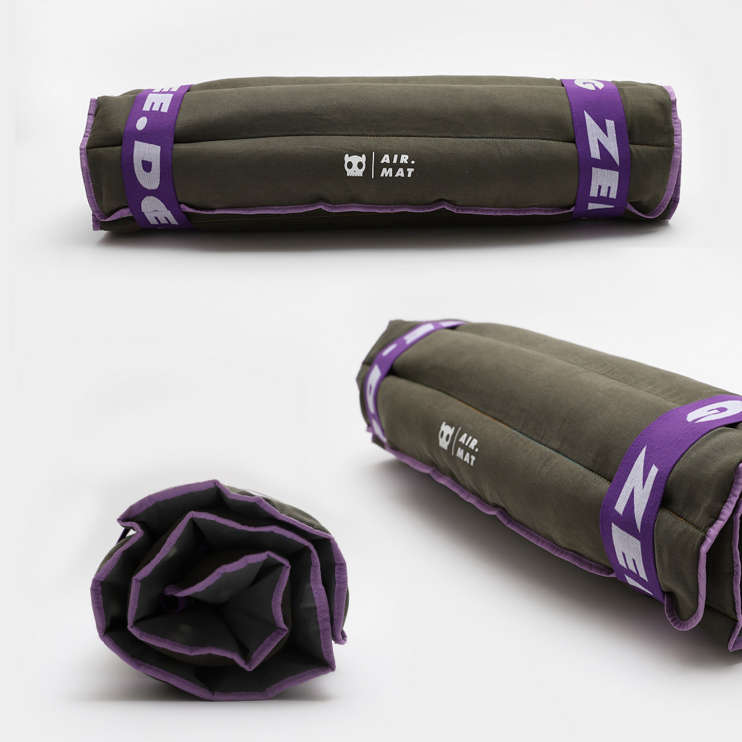Two rolled-up air mats with purple straps on a white background