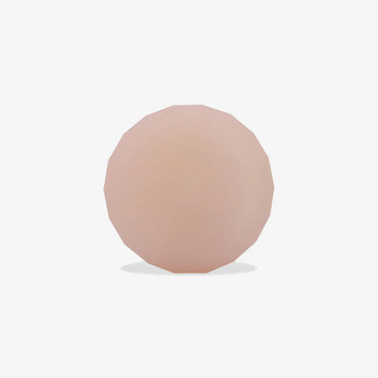 Round, pink-coloured airtag holder on a white background