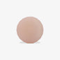 Round, pink-coloured airtag holder on a white background
