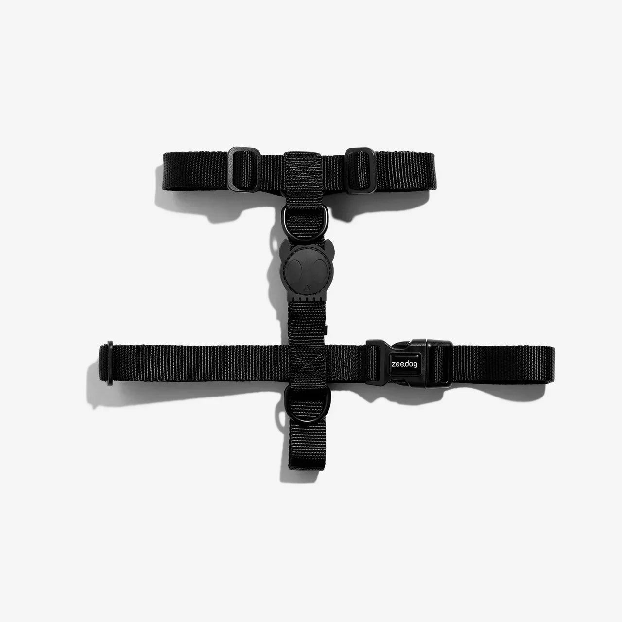 Black dog harness on a white background