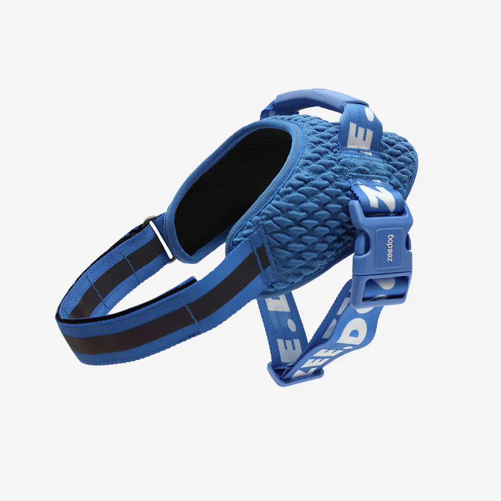 Blue dog harness with brand logo on a white background