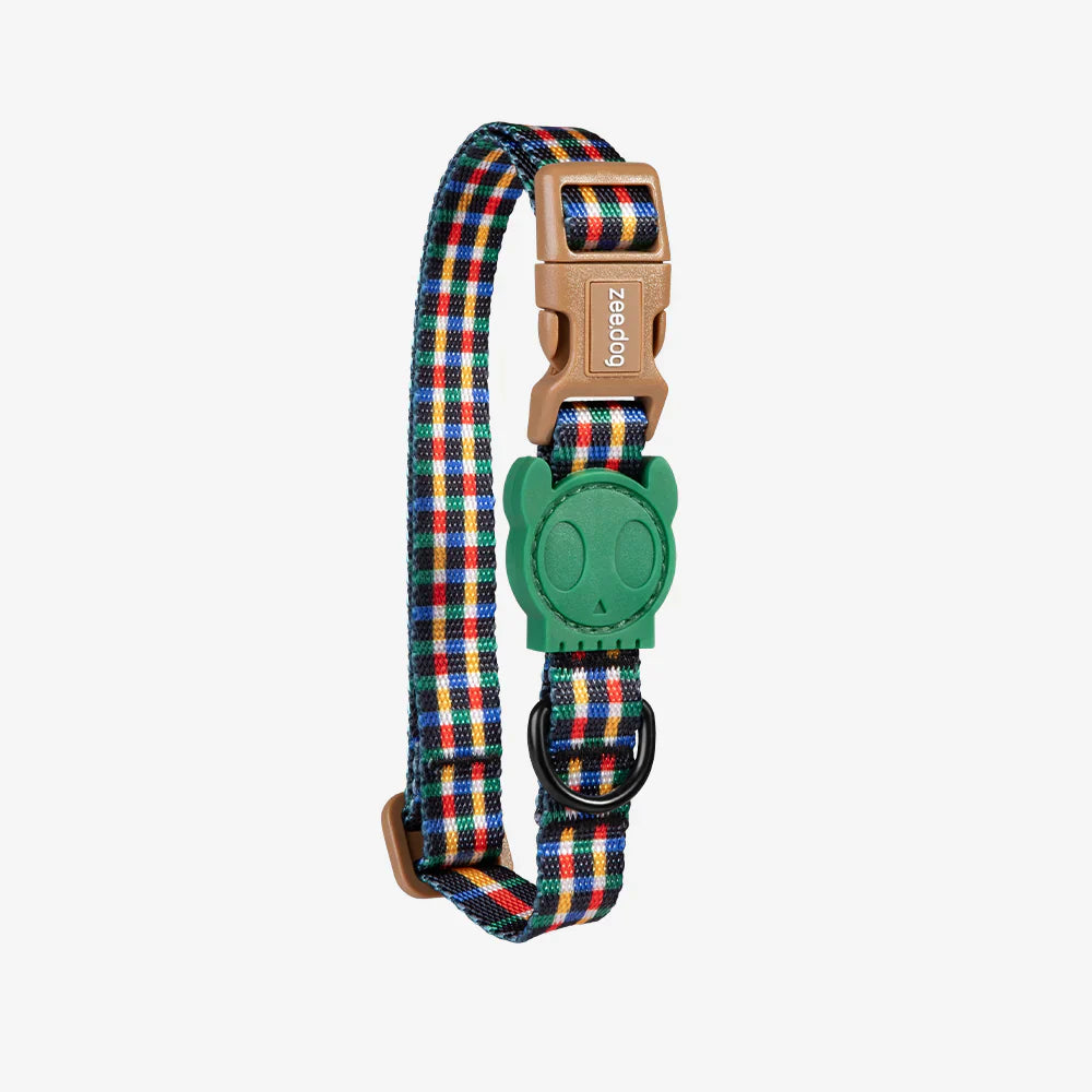 Dog collar with colorful plaid pattern and green plastic buckle on a white background