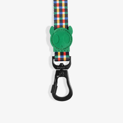Dog leash with green clip and colorful plaid pattern on a white background