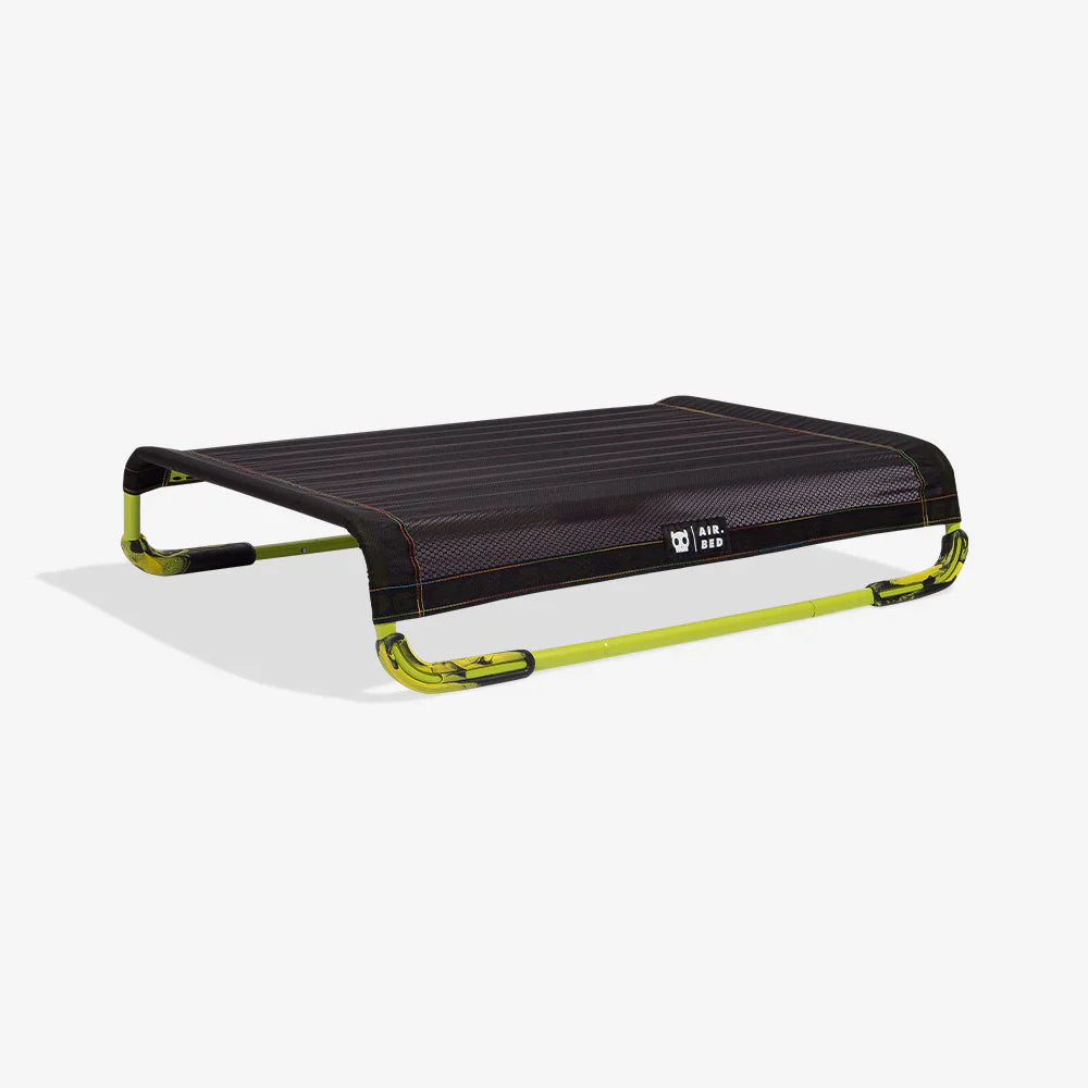 Black and green air bed on a white background