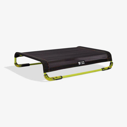 Black and green air bed on a white background