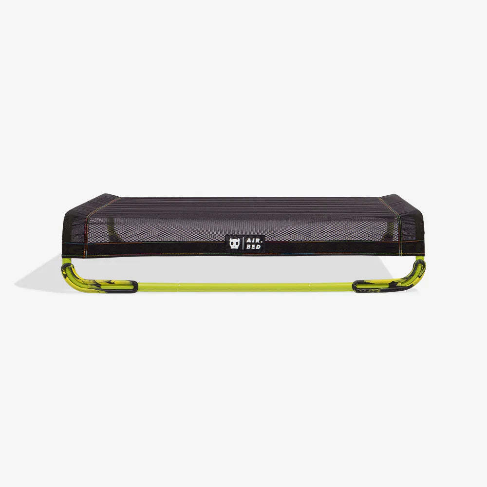 Black and green air bed on a white background