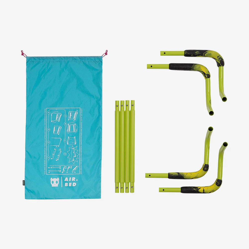 Green air bed frame and blue carrying bag on a white background