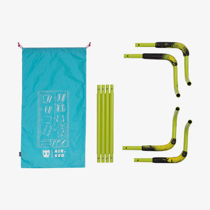 Green air bed frame and blue carrying bag on a white background