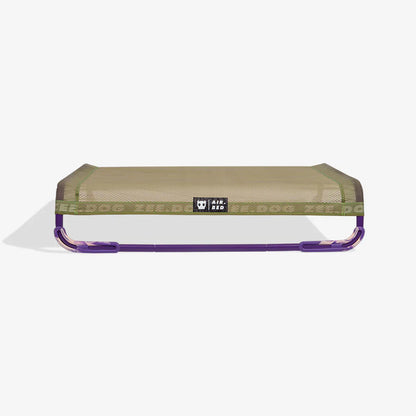 air bed with mesh top and purple frame on a white background