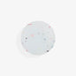 Round, white airtag holder with colourful specks on a light grey background