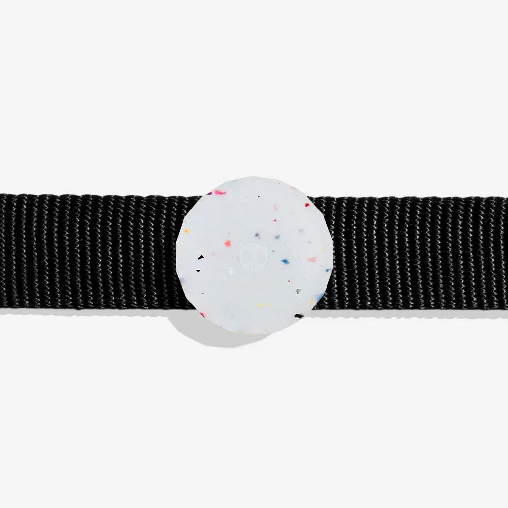 Black dog collar with a Round, white airtag holder with colourful specks on a light grey background